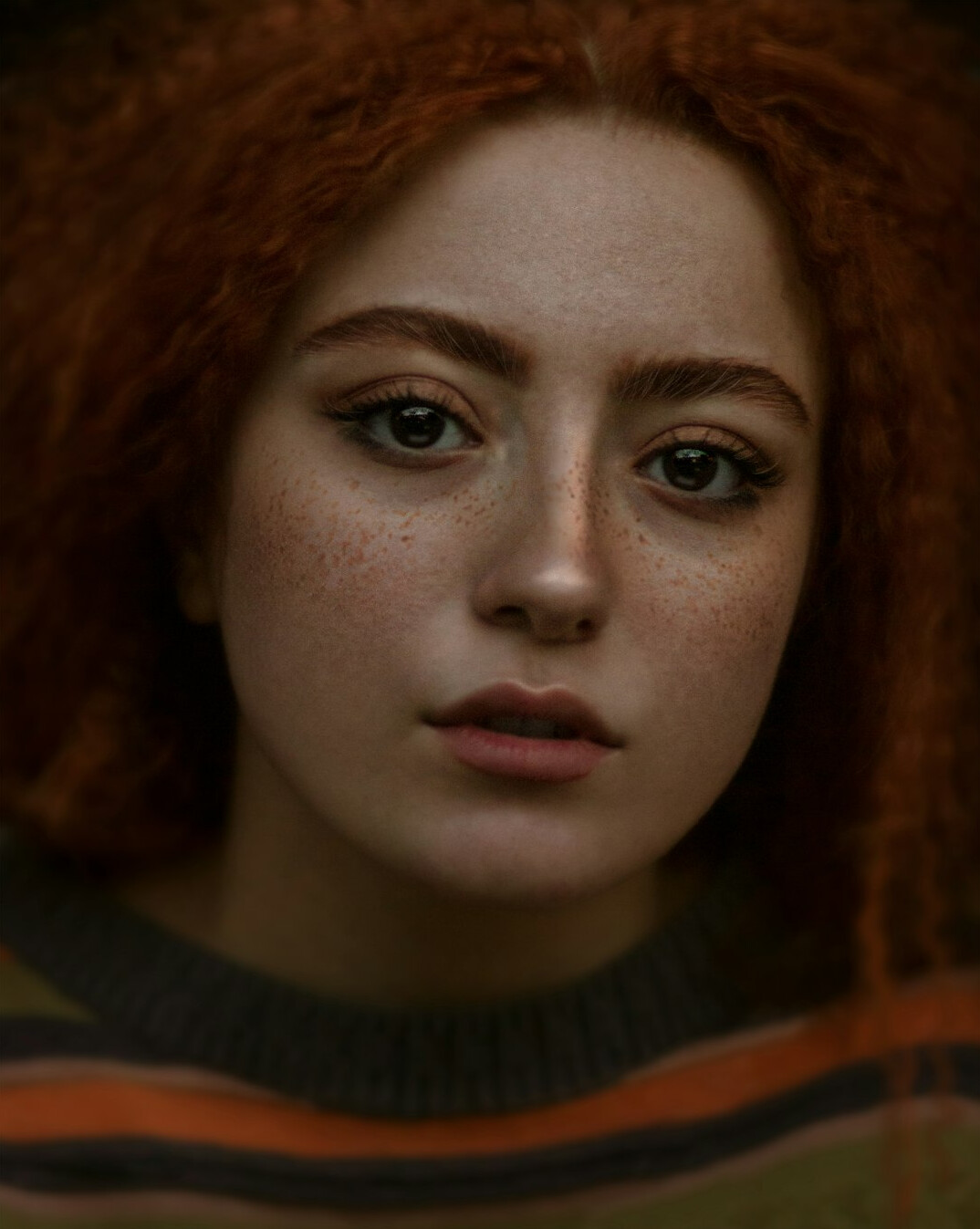 Portrait of a woman with auburn hair, sound and workflow producer