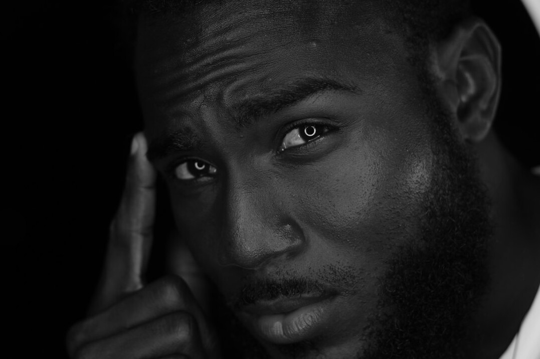 Portrait of a Black man with a beard, camera tutor